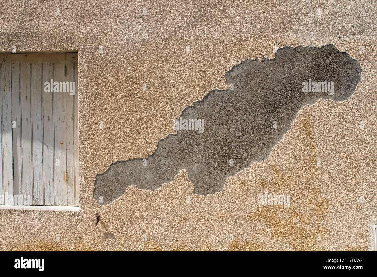 France, ripped out rendering on the wall of a private mansion Stock Photo