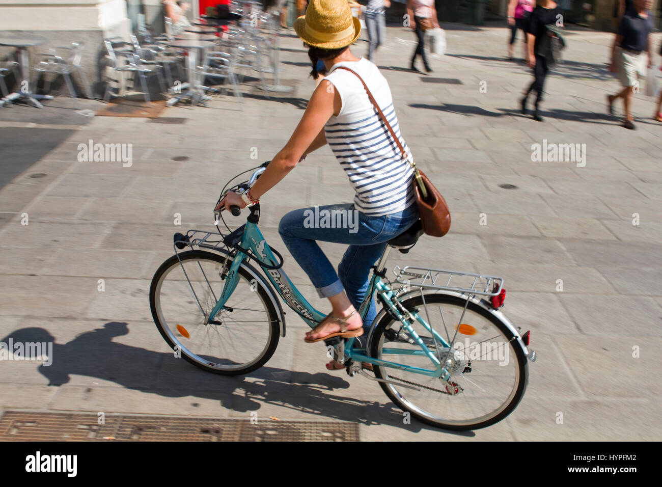 France, North-Western France, Nantes, woman on a bike Stock Photo