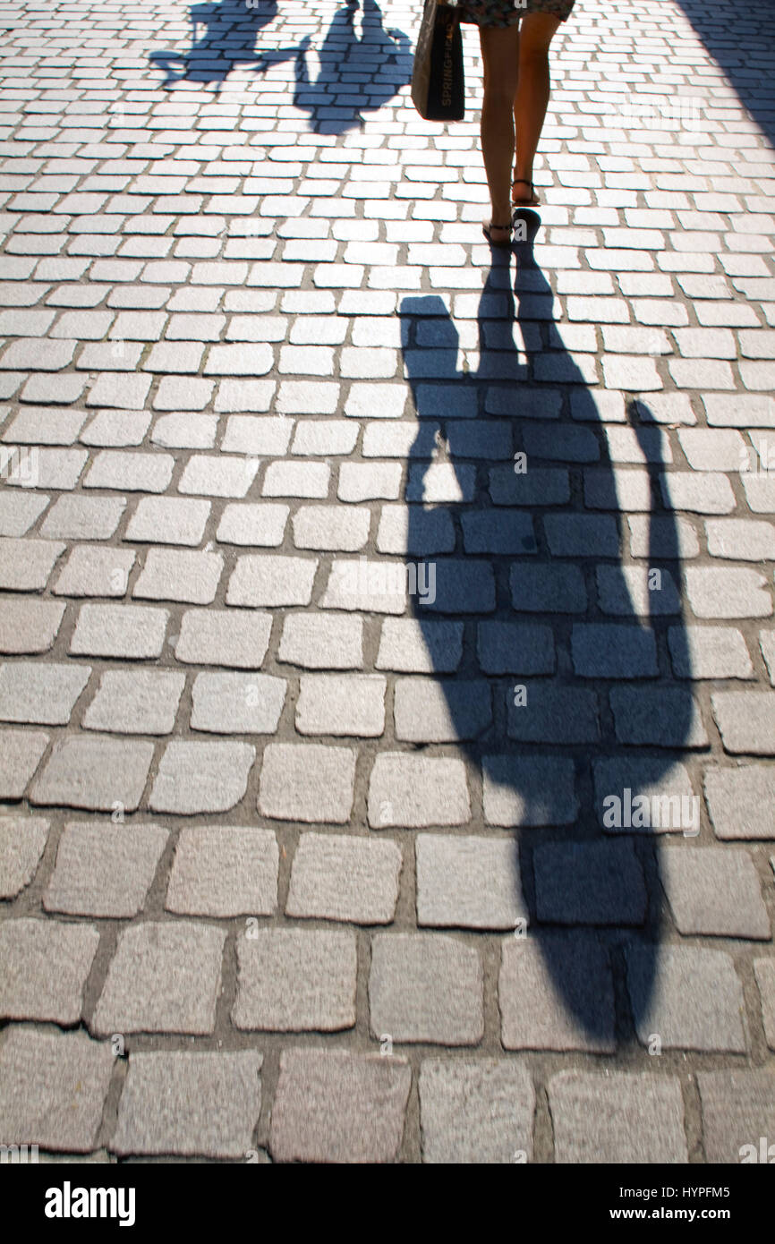 France, North Western France, Nantes, shade of a woman moving away. Stock Photo