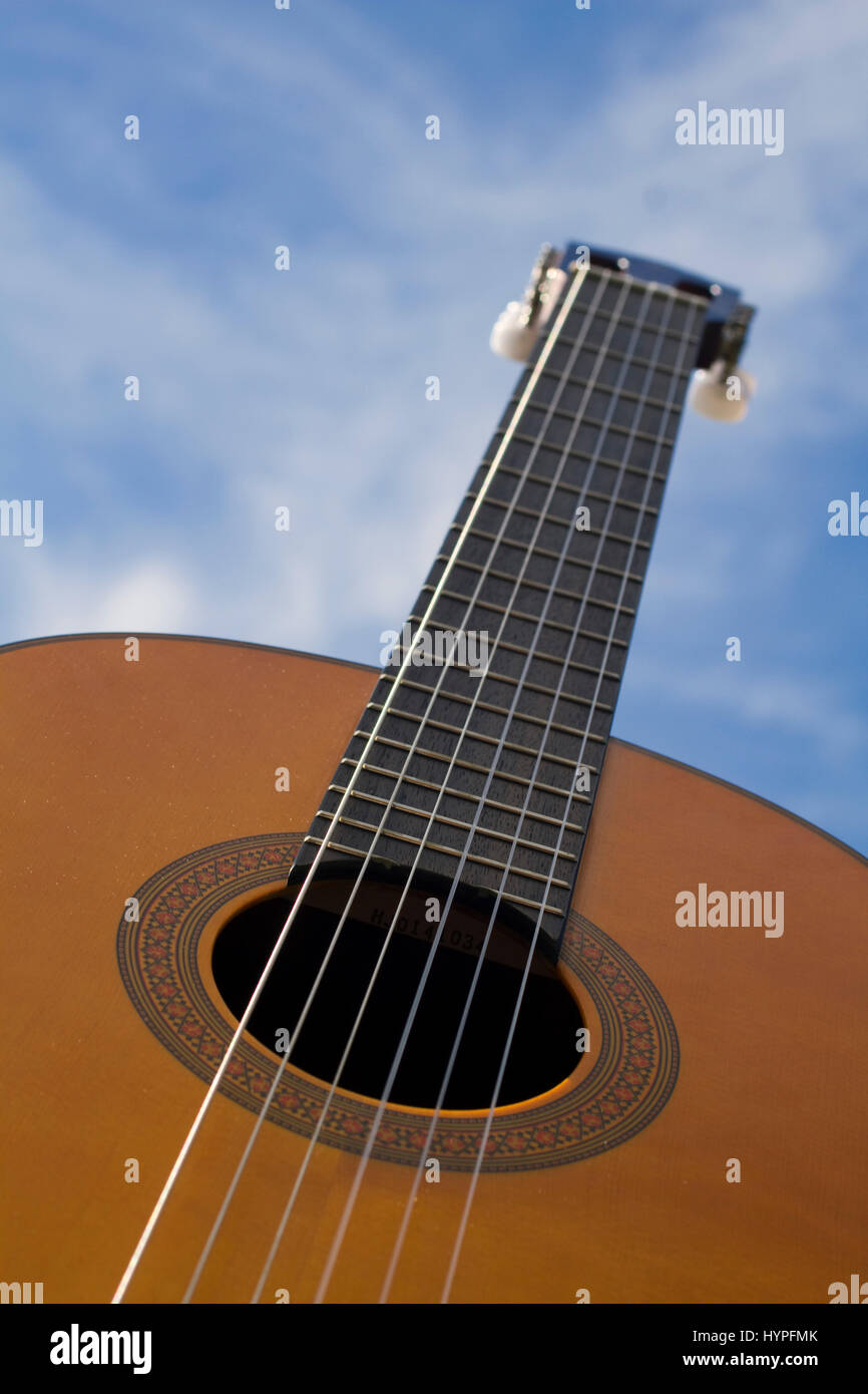 Acoustic guitar sight in low-angle shot. Stock Photo