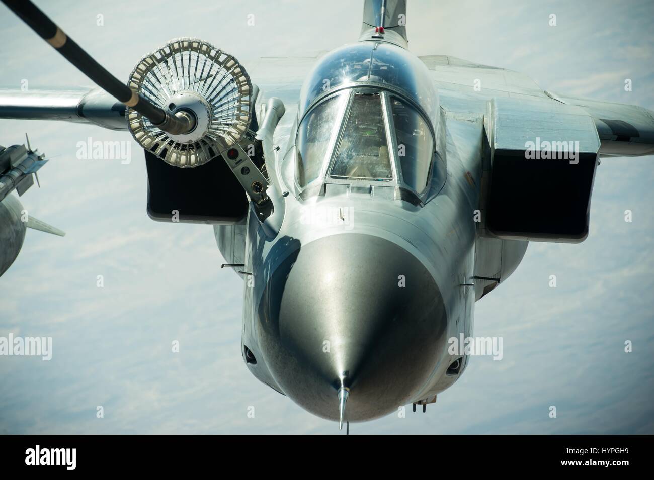 A German Air Force Tornado GR 4 attack aircraft refuels in flight during Operation Inherent Resolve fighting the Islamic State February 22, 2017 over Iraq. Stock Photo
