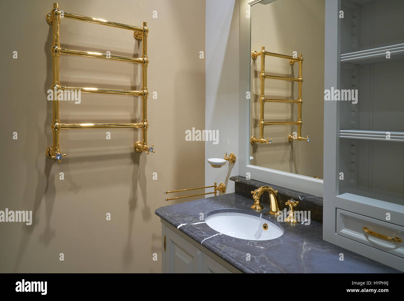 Luxury Interior bathroom with gold painted faucet and heated towel rail  Stock Photo - Alamy