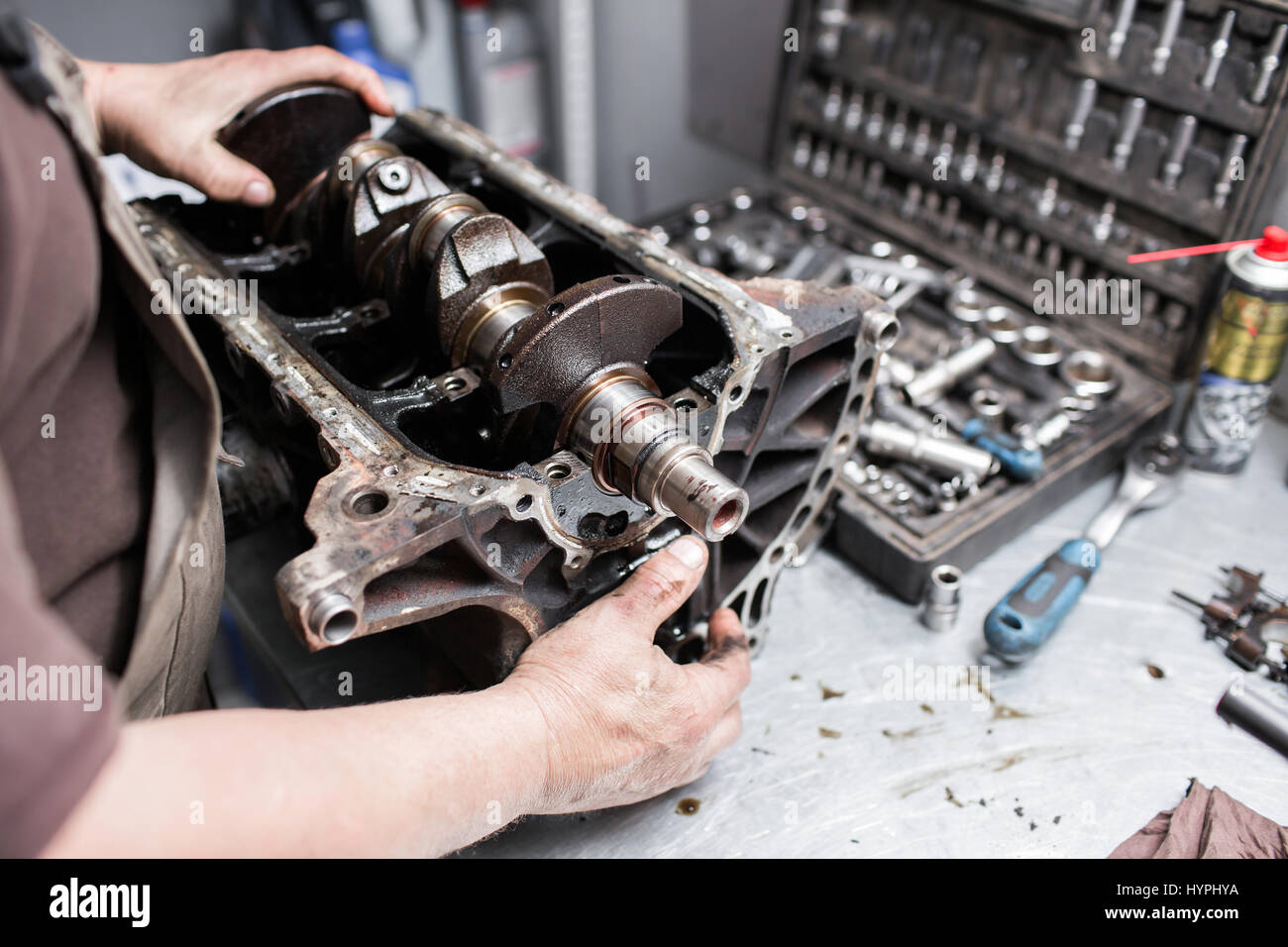 Engine crankshaft, valve cover, pistons. mechanic repairman at