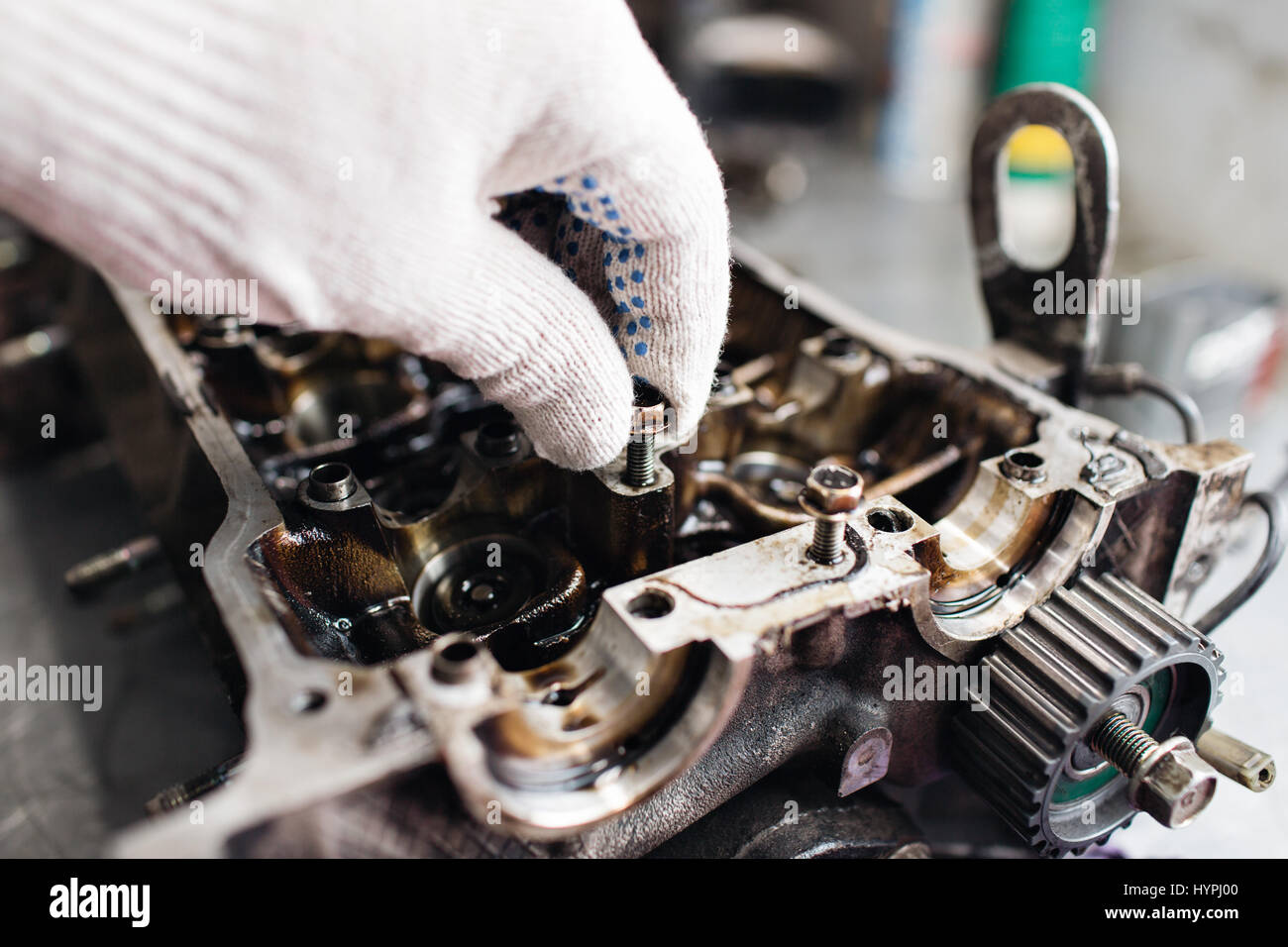 Engine crankshaft, valve cover, pistons. mechanic repairman at