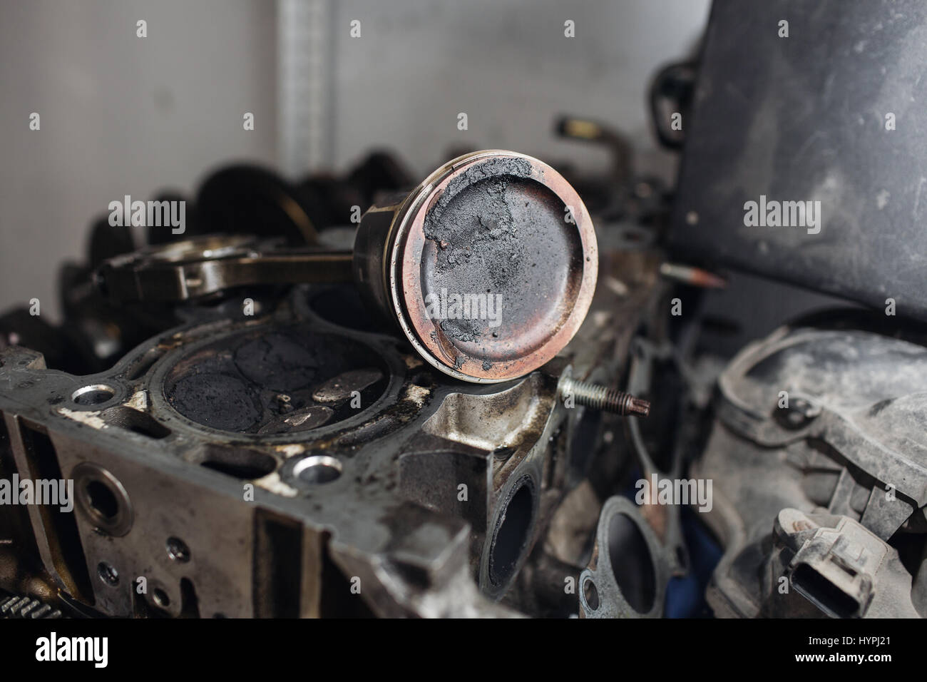 Engine valve car maintenance. A deposit on a piston, a large run a long