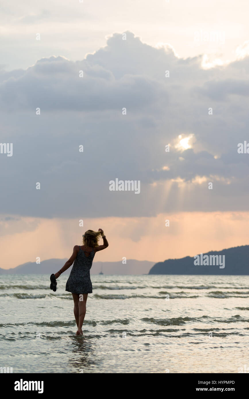 Beautiful woman laying on beach hi-res stock photography and images - Alamy