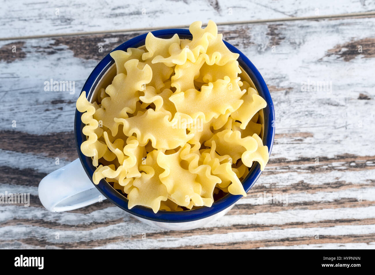 short pasta in metal cup reginelle Angle Stock Photo