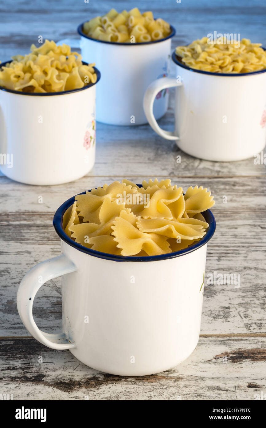 dried pasta in metal bowl butterflies front Stock Photo