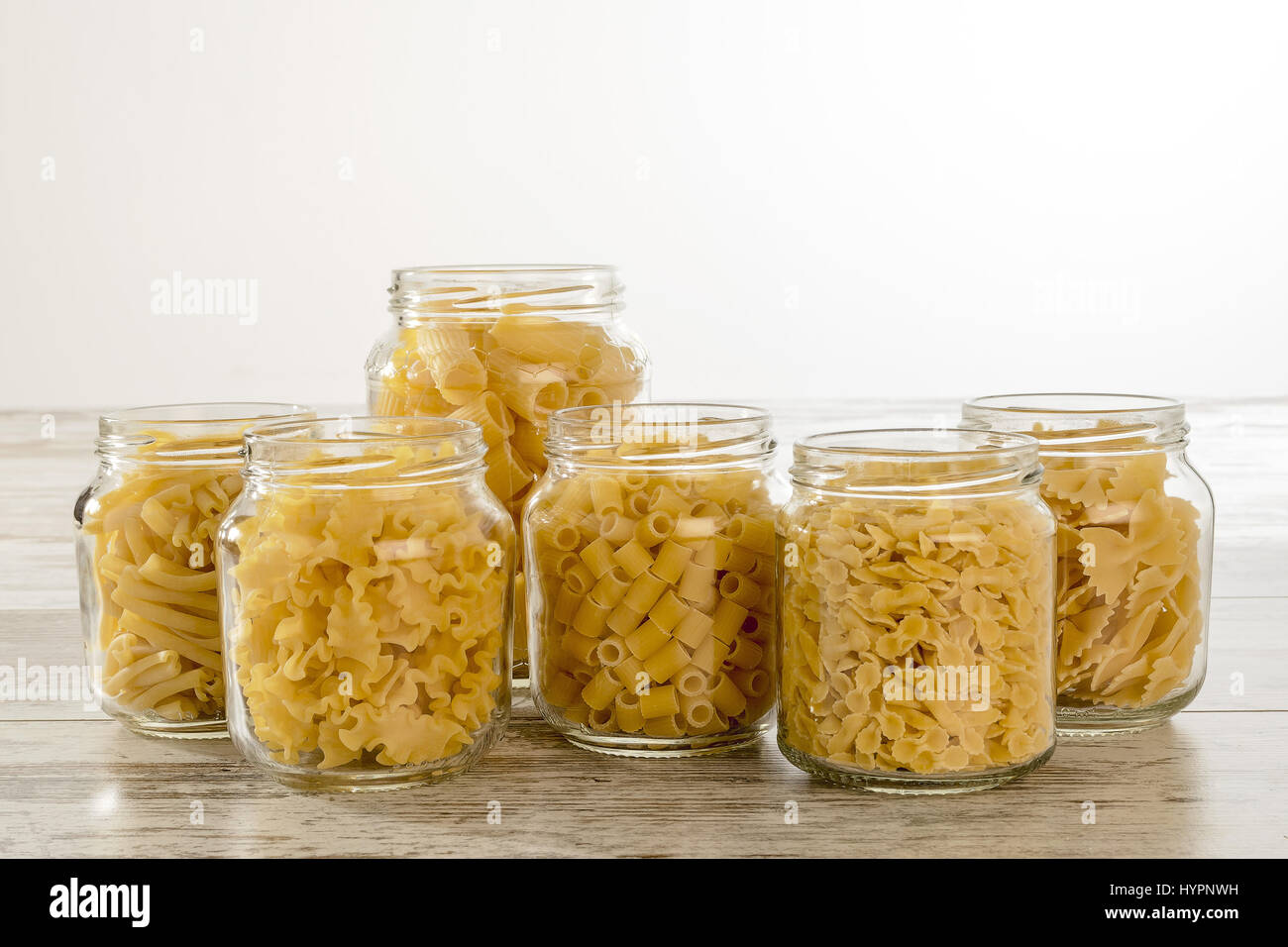 short dry pasta in glass jars without lid face Stock Photo