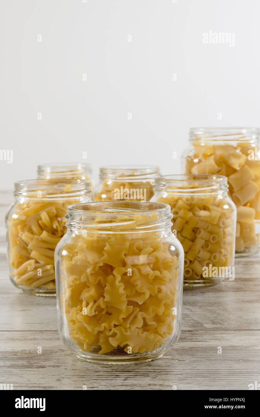 short dry pasta in glass jar reginelle front Stock Photo