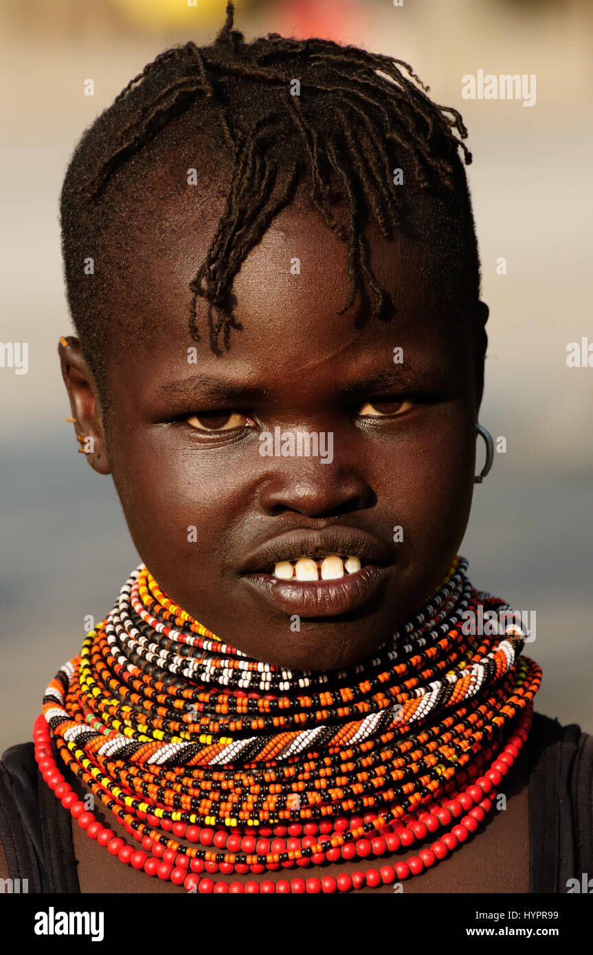 LOIYANGALANI, KENYA - JULY 14: Portrait african girl from the Turkana tribe in the traditional dress in transit to the market in Kenya,Loiyangalani in Stock Photo