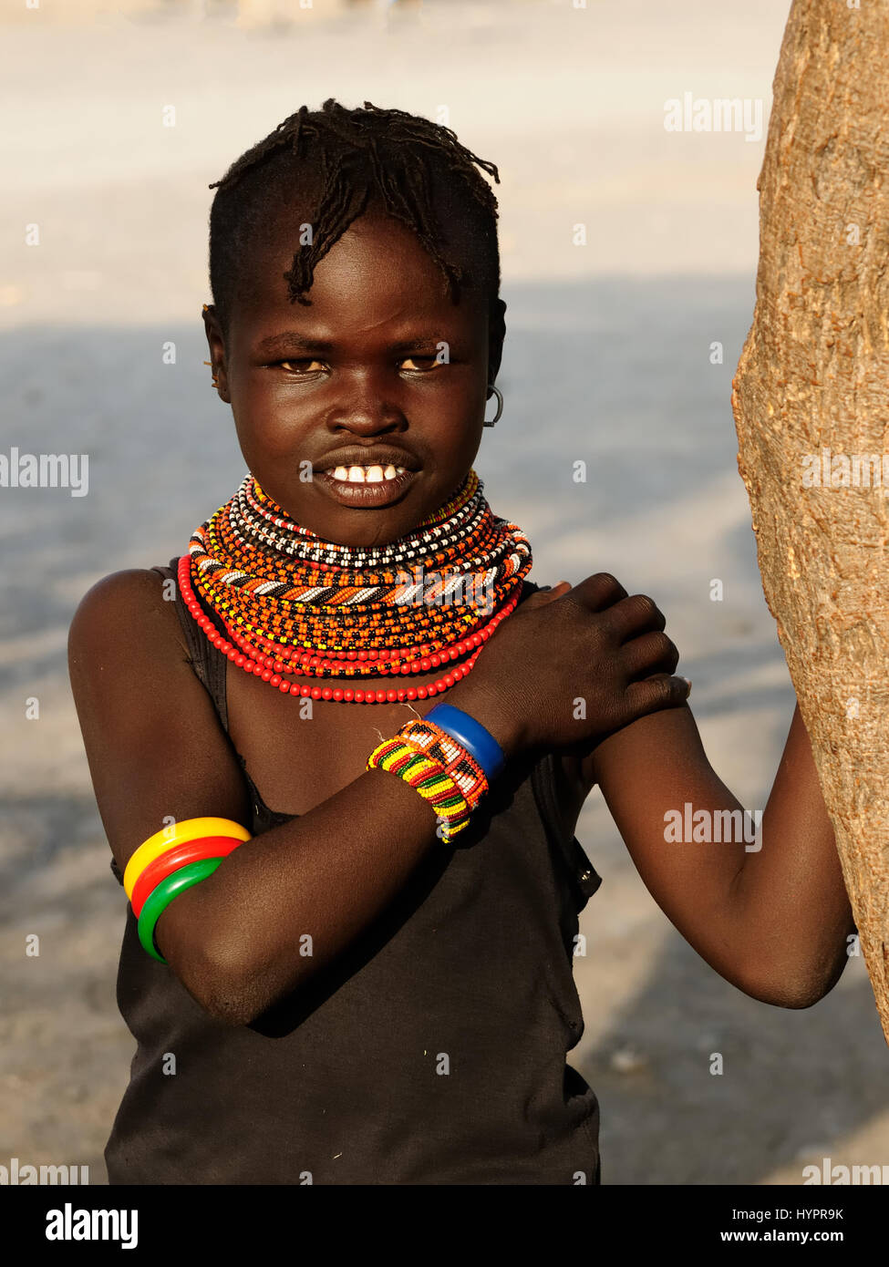 LOIYANGALANI, KENYA - JULY 14: Portrait african girl from the EL Molo tribe in the traditional dress in transit to the market in Kenya,Loiyangalani in Stock Photo