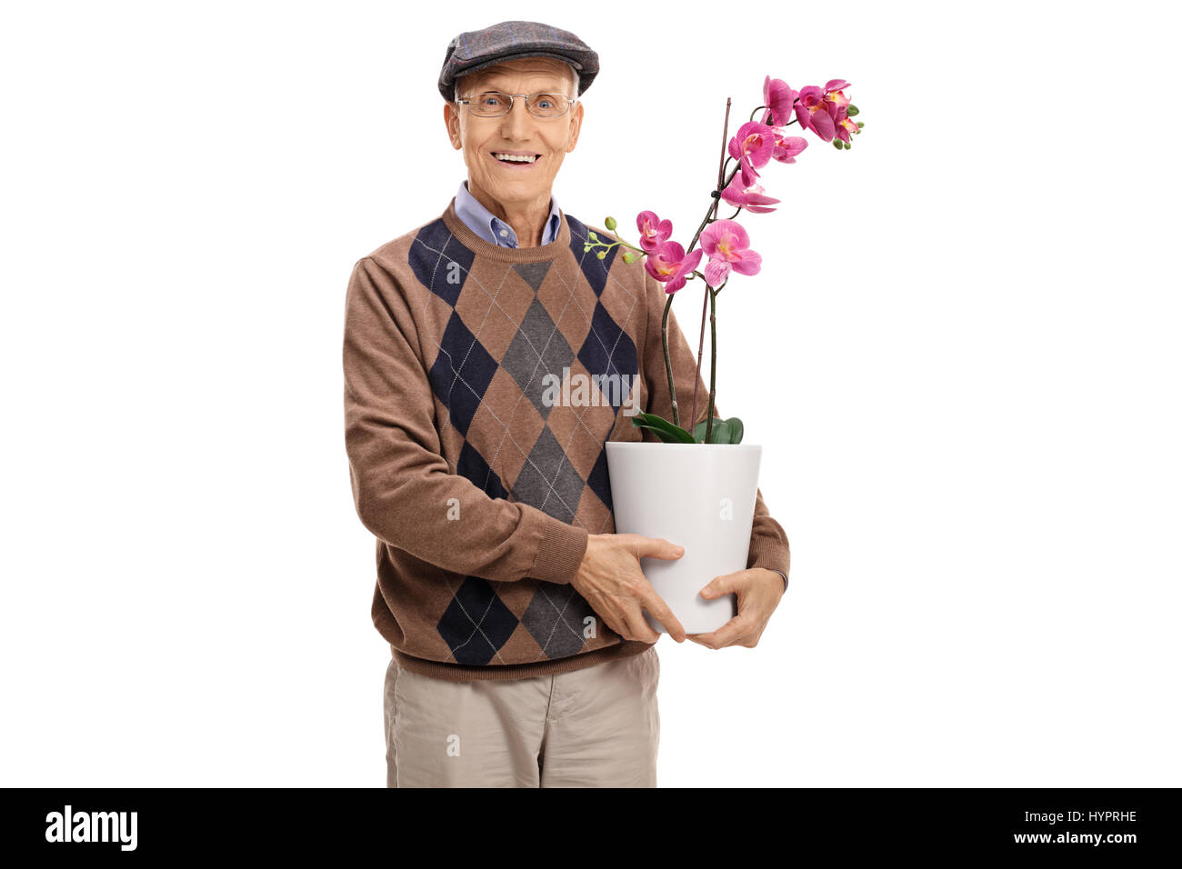 Senior with an orchid flower in a pot looking at the camera isolated on white background Stock Photo