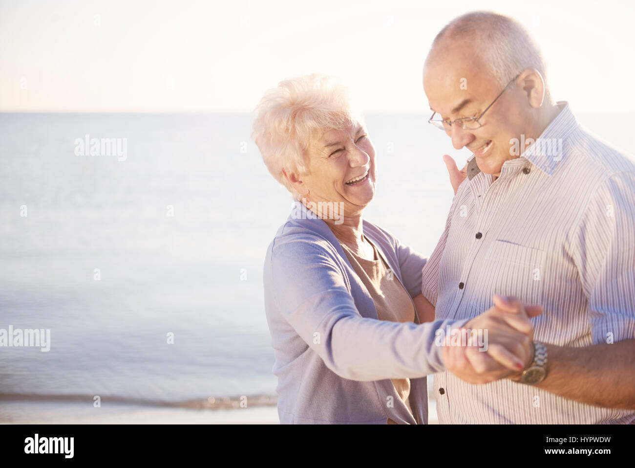 Woman dancing in sunset on hi-res stock photography and images - Alamy