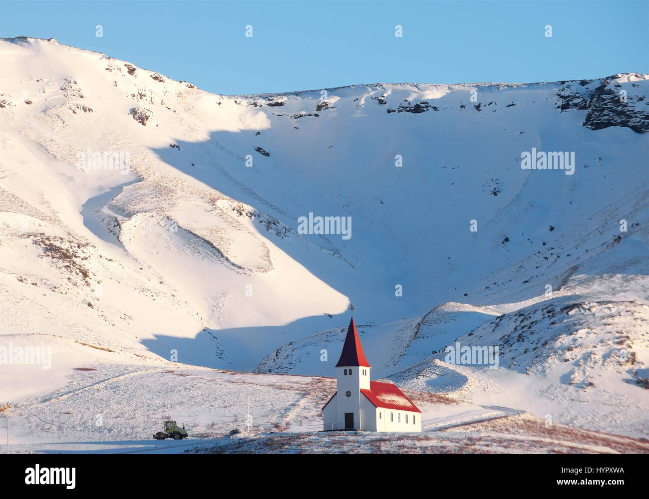 Vik church on the southern part of Iceland is near the Black Sand Beach (Reynisfjara) Stock Photo