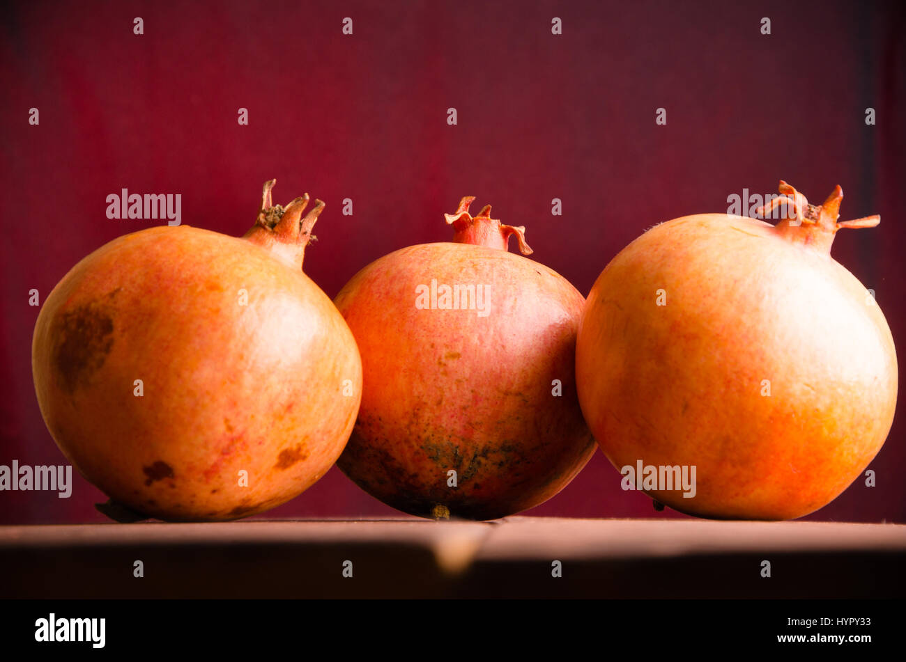 juicy pomegranate on wooden boards. ripe pomegranate on wooden boards ...