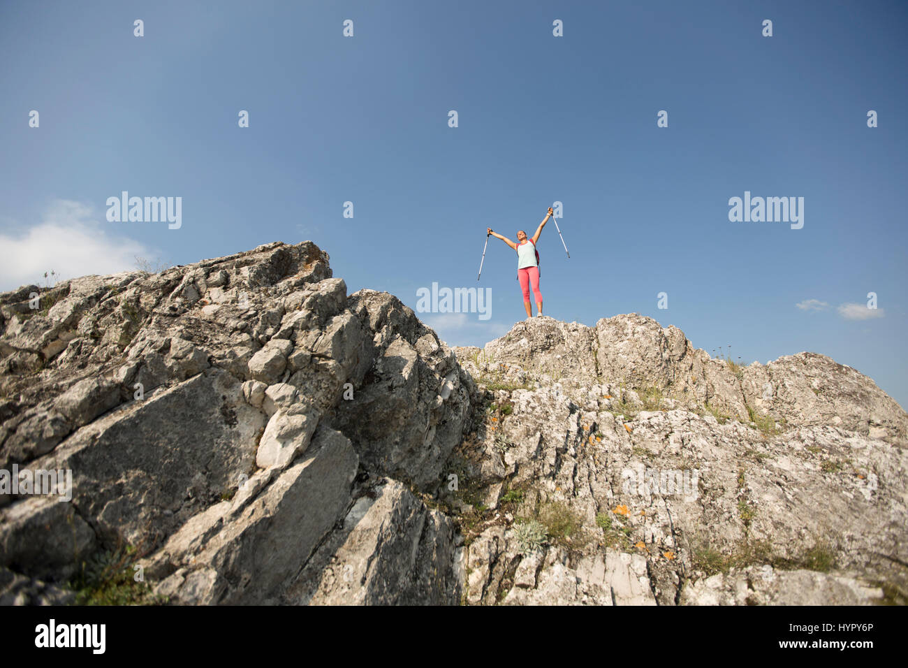 Successful woman hiker open arms at mountain peak Stock Photo - Alamy