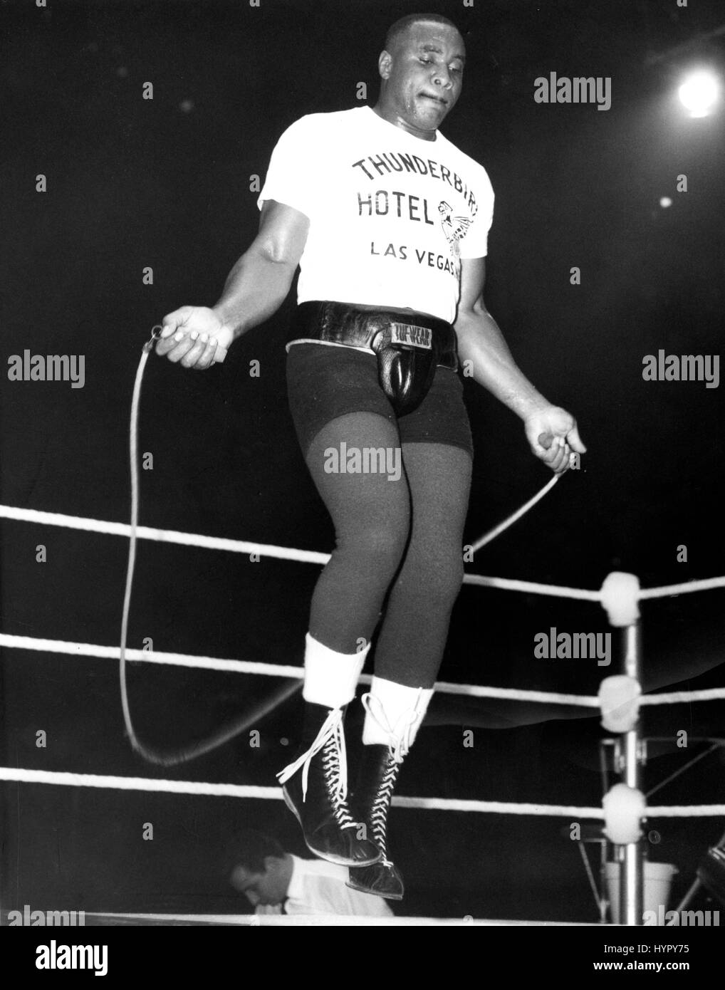 American world heavyweight champion Sonny Liston demonstrates his now famous skipping routine, which is done to the tune of 'Night Train' during an exhibition of his training routine at the Empire Pool, Wembley, as part of the programme. Stock Photo