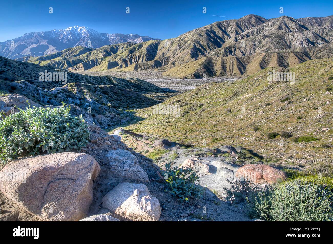 Scenic view of snowcapped mountains along the Pacific Crest National Scenic Trail at the Sand to Snow National Monument March 20, 2017 in San Bernardino County, California. Sand to Snow National Monument is an ecological and cultural treasure and one of the most biodiverse areas in southern California, supporting more than 240 species of birds and twelve threatened and endangered wildlife species. Stock Photo