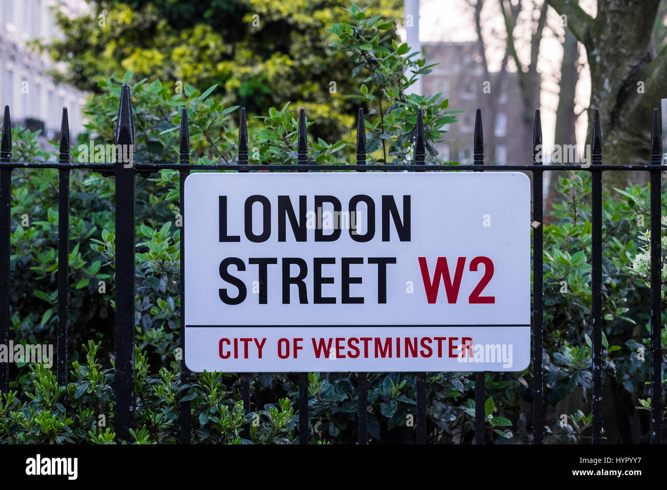 London Street W2 road sign attached to railings, Paddington, London, England, U.K. Stock Photo