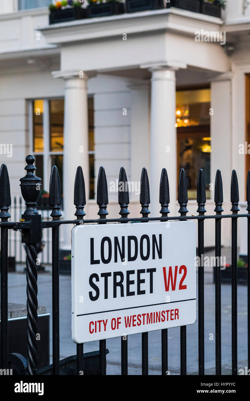 London Street W2 road sign attached to railings, Paddington, London ...