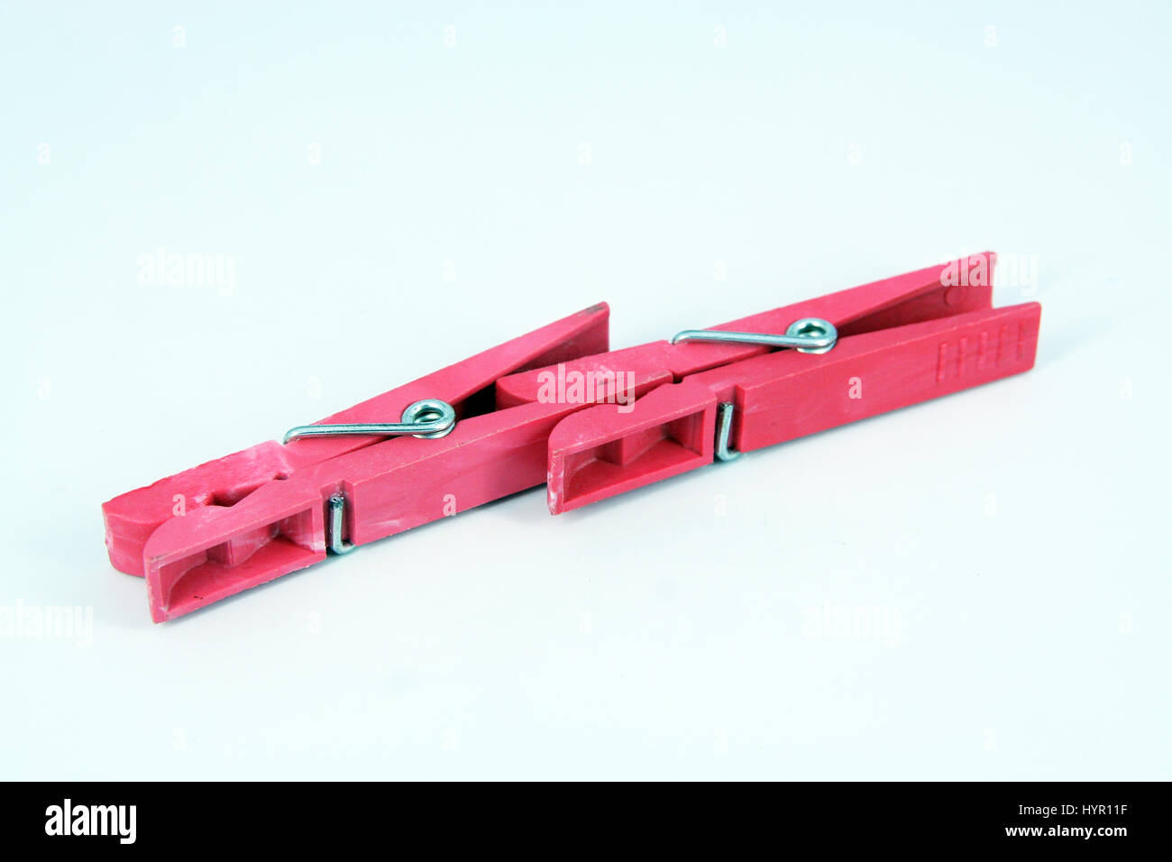 Red plastic clothespin. Stock Photo