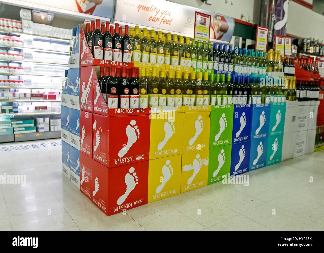 A variety of Barefoot wine cases is stacked on the floor in a Stock