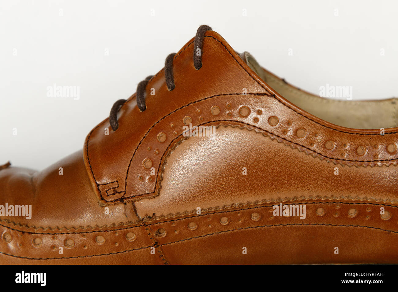 Closeup of a men's used brown dress shoe. Stock Photo