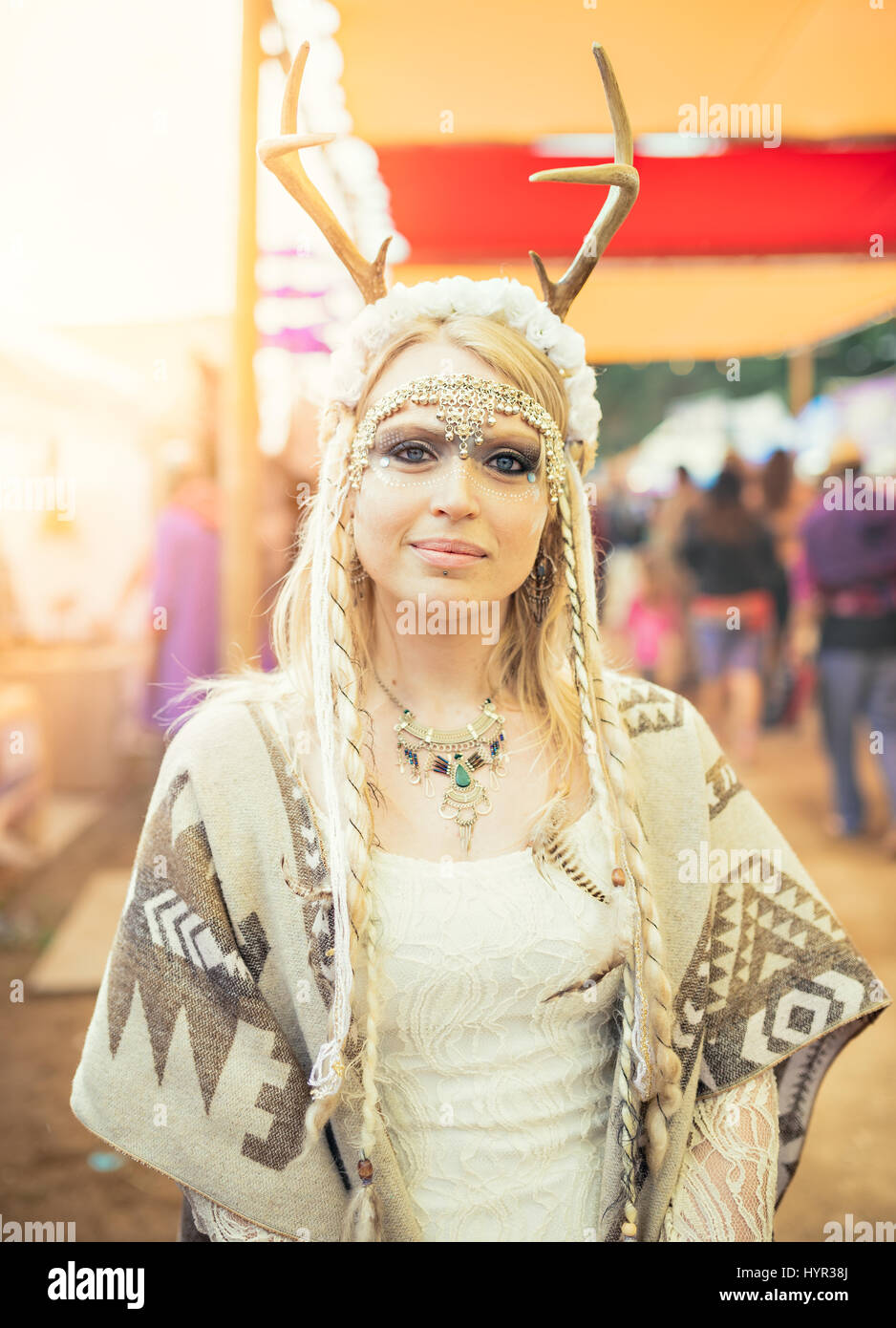 Female music festival attendee in costume. Stock Photo