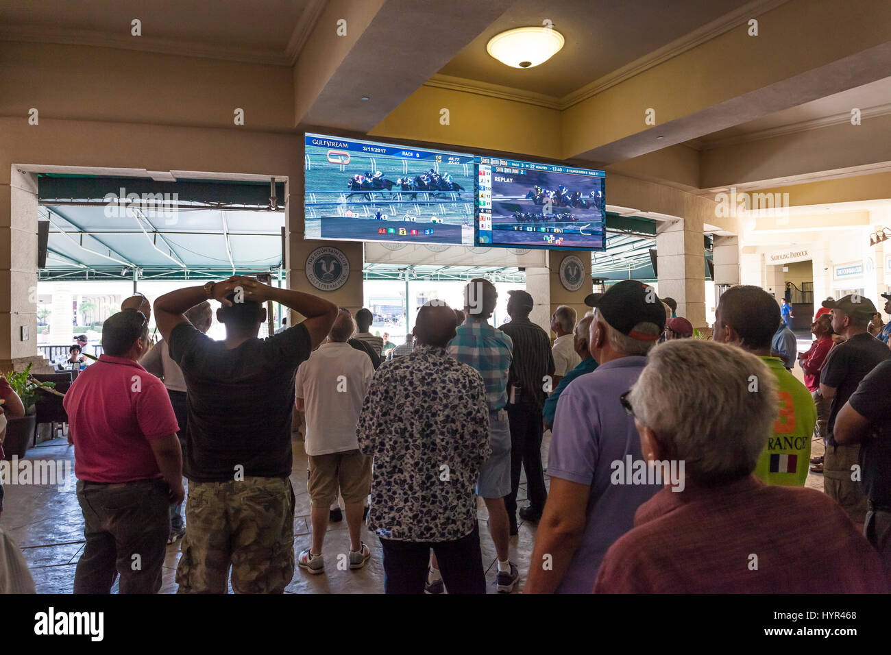 HALLANDALE BEACH, USA - MAR 11, 2017: People betting on horse races in the Gulfstream park casino in Hallandale Beach. Florida, United States Stock Photo