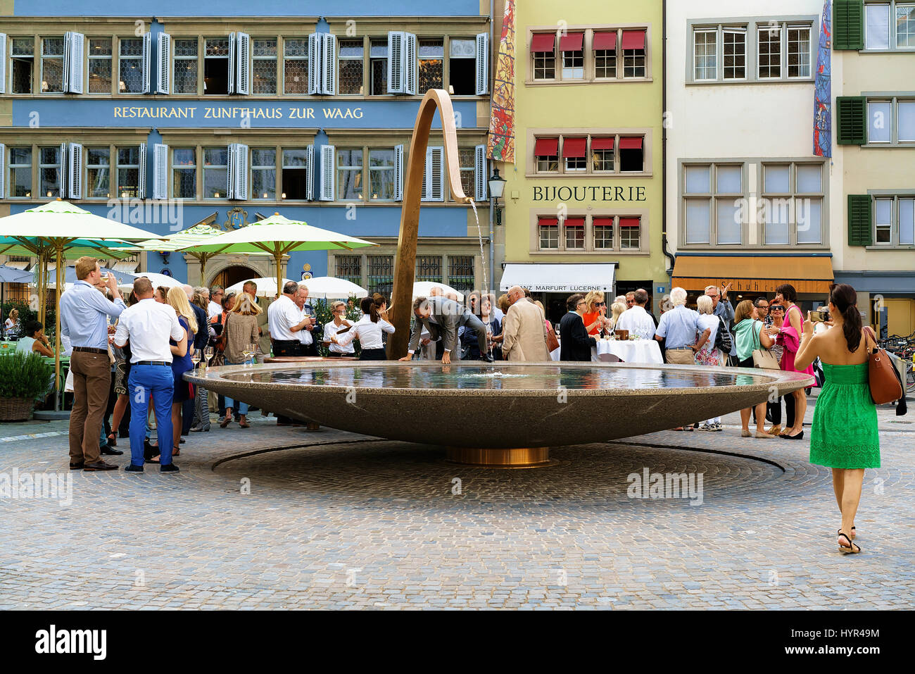 Zurich, Switzerland - September 2, 2016: People and fountain at Munsterhof square in Zurich, Switzerland Stock Photo