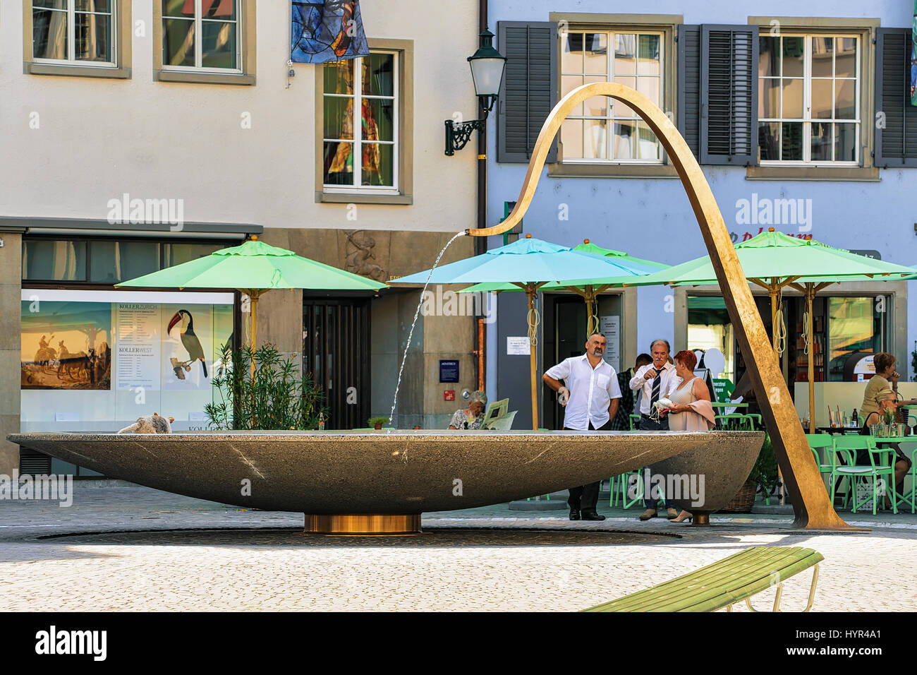 Zurich, Switzerland - September 2, 2016: Fountain and people on Munsterhof square in Zurich, Switzerland Stock Photo