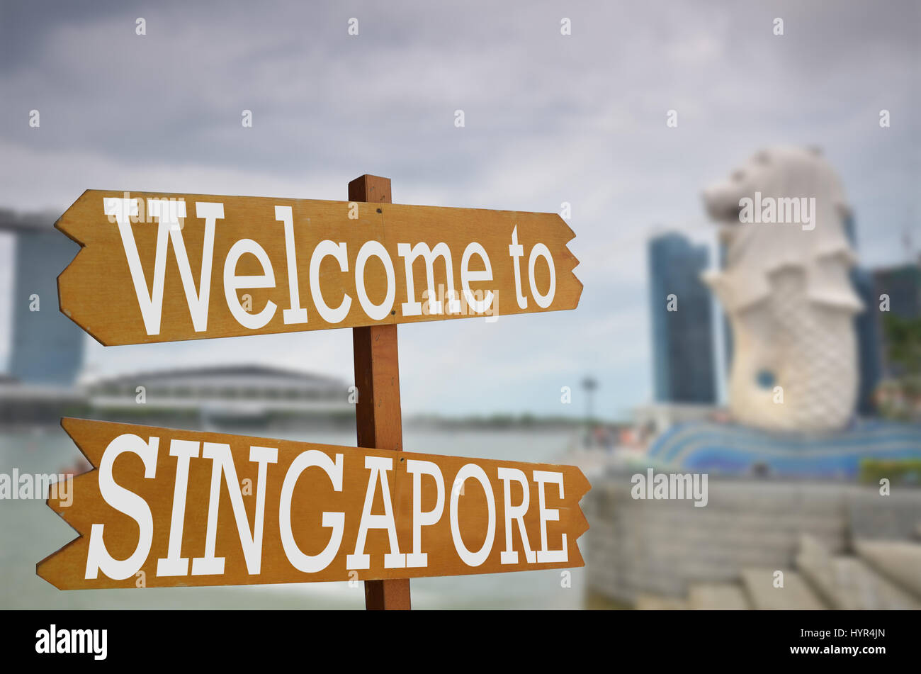 Welcome to Singapore sign with Merlion in background Stock Photo - Alamy