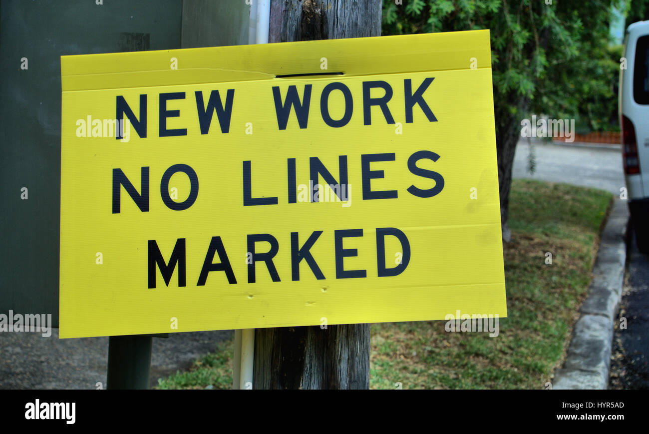 Road sign saying 'New Work No Lines Marked' warning road users and drivers in Australia. Stock Photo