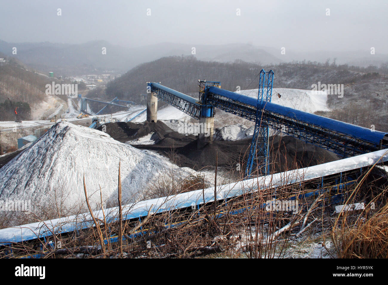 Conveyors carry processed coal to a loading station in Central Appalachia, where the coal industry has remained relevant to the economy for decades. Stock Photo