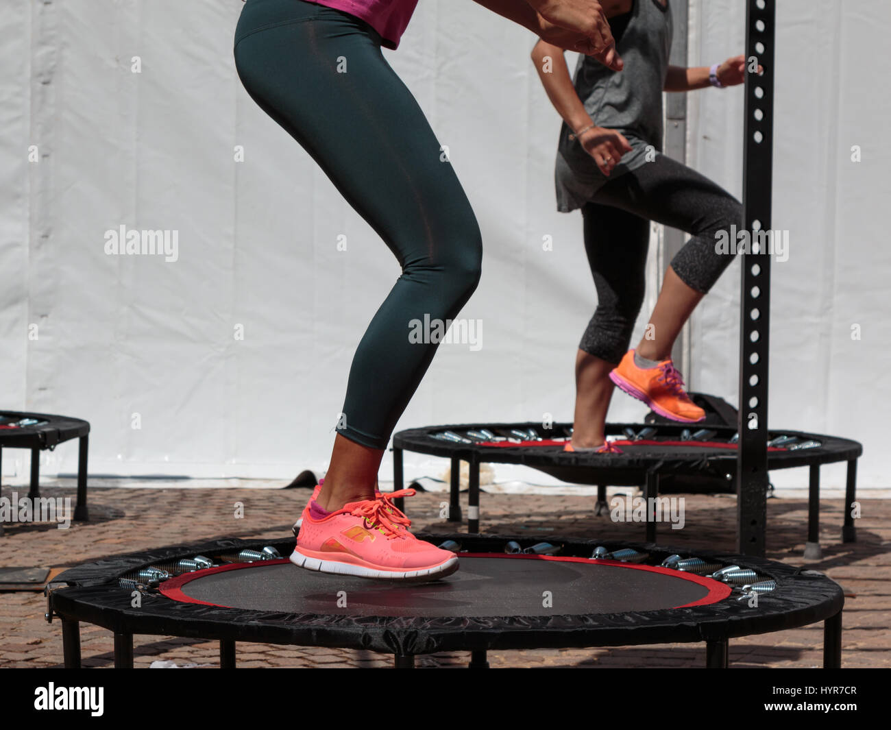 Mini Trampoline Workout: Girl doing Fitness Exercise in Class at Gym Stock  Photo - Alamy