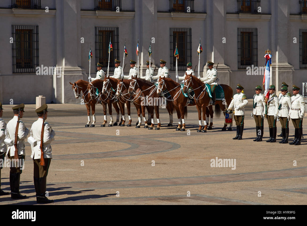 Carabineros de Chile in white summer uniform performing the Changing of the Guard ceremony outside La Moneda in Santiago, capital of Chile. Stock Photo