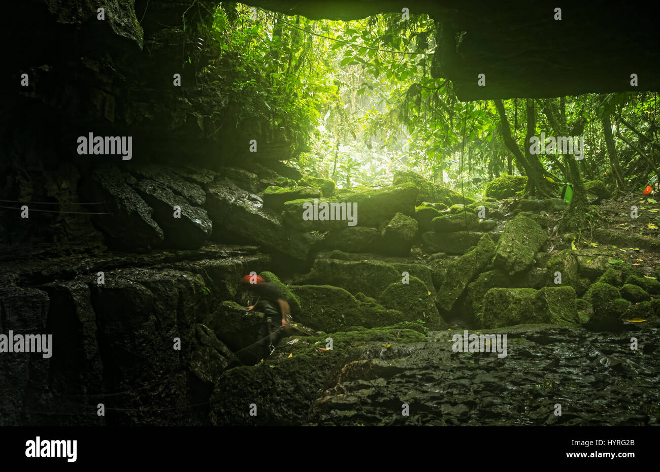 Speleologists At Mayei Cave The Cave Where The Wind Is Born (Cueva Donde Nace El Viento) In Ecuadorian Amazonia Waterfall Entrance Blurred Motion Stock Photo