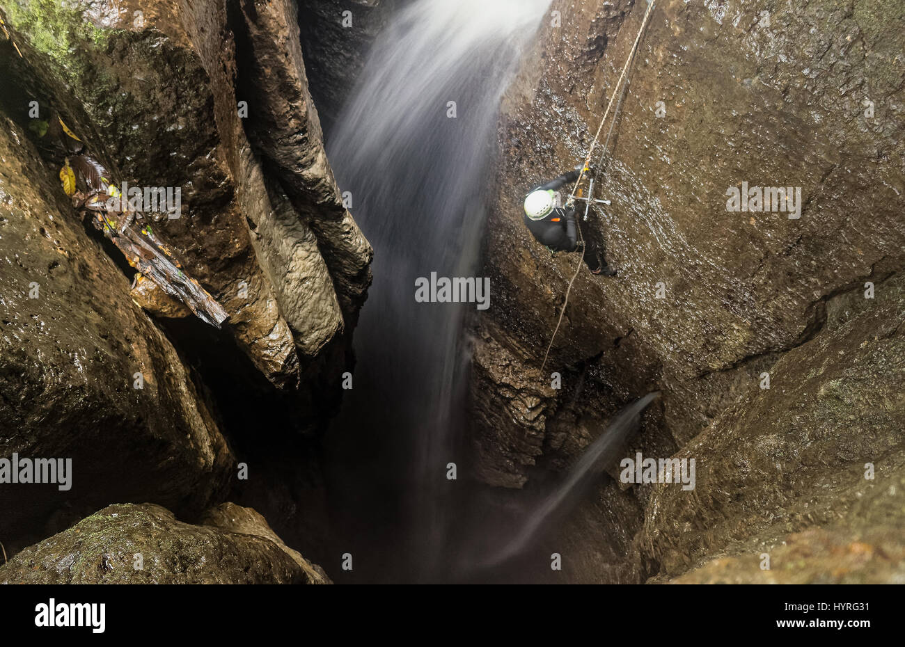 Speleologist Interior Of Mayei Cave Waterfall Entrance Shaft In Ecuadorian Amazonia Stock Photo