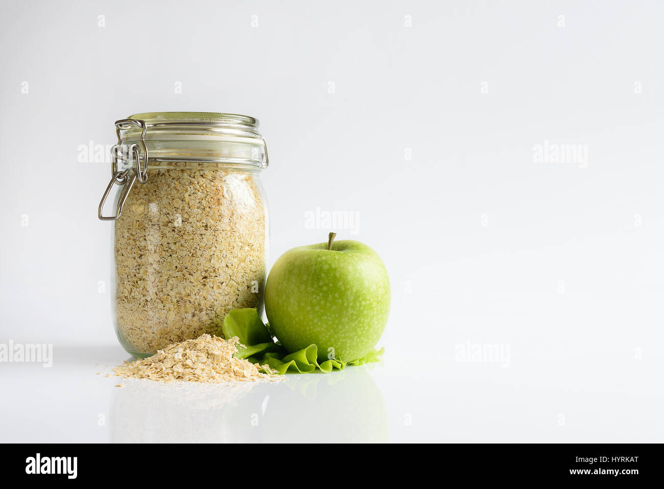 oatmeal and green apple on white background Stock Photo Alamy