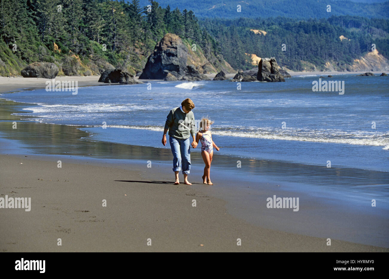 Mother and daughter wander along a section of the Oregon Pacific Coast