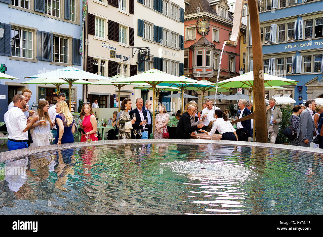 Zurich, Switzerland - September 2, 2016: People and fountain on Square Munsterhof of Zurich, Switzerland Stock Photo