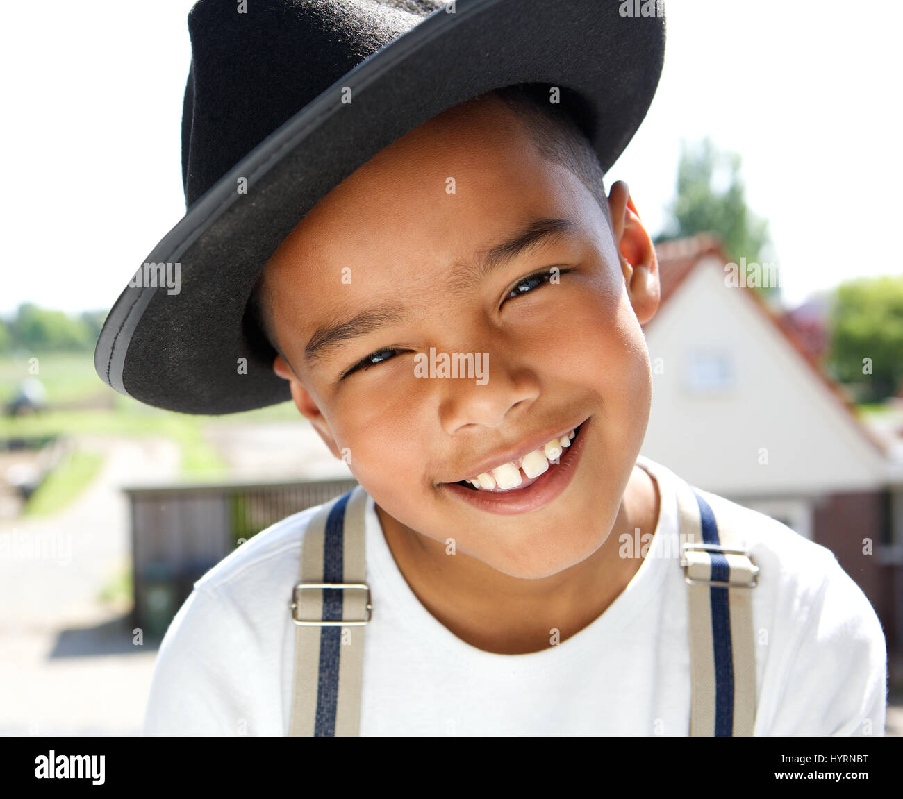 Close up portrait of a cute little boy smiling with hat outdoors Stock ...