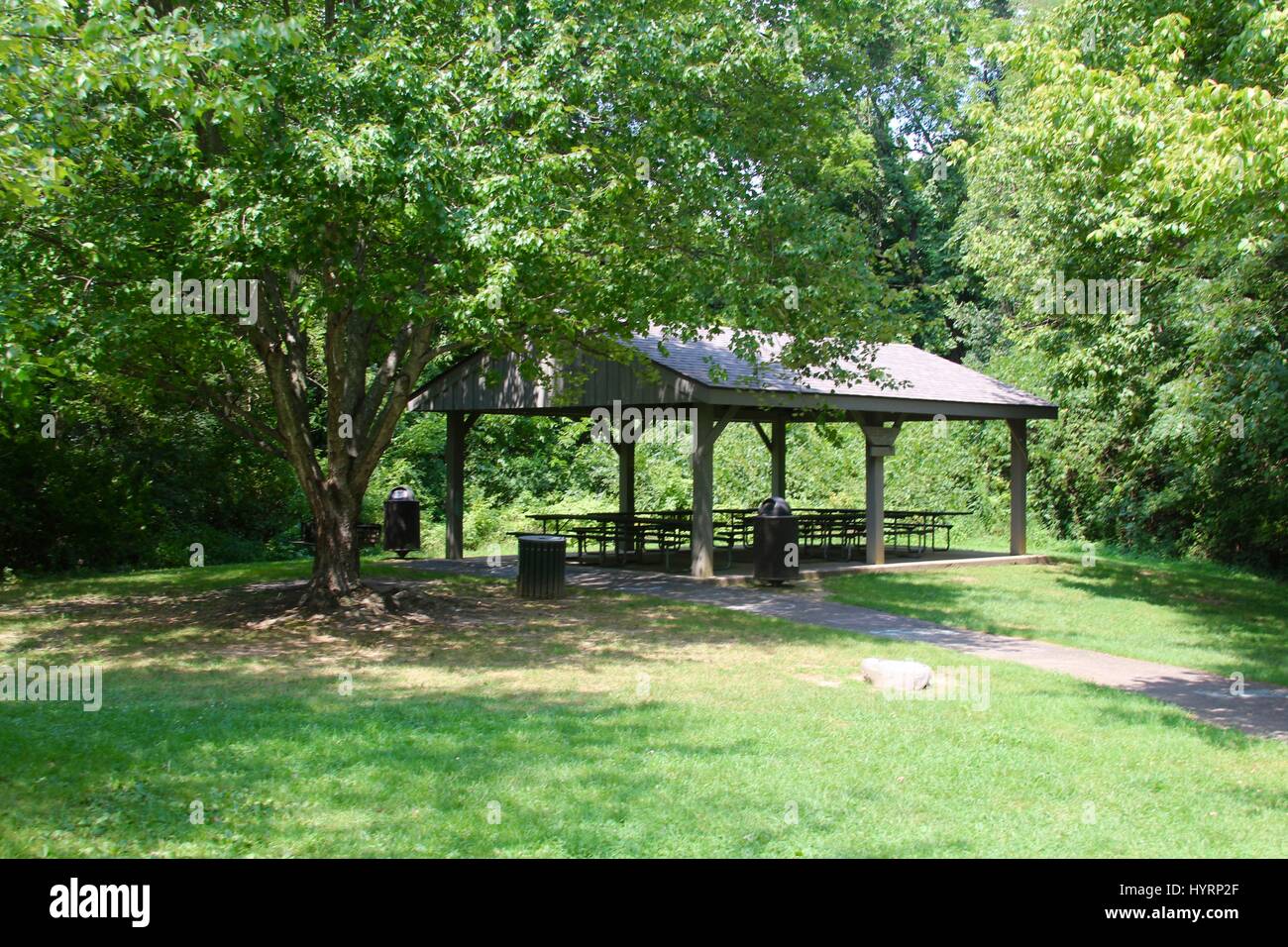 The picnic shelter in the park on a sunny summer day. Stock Photo