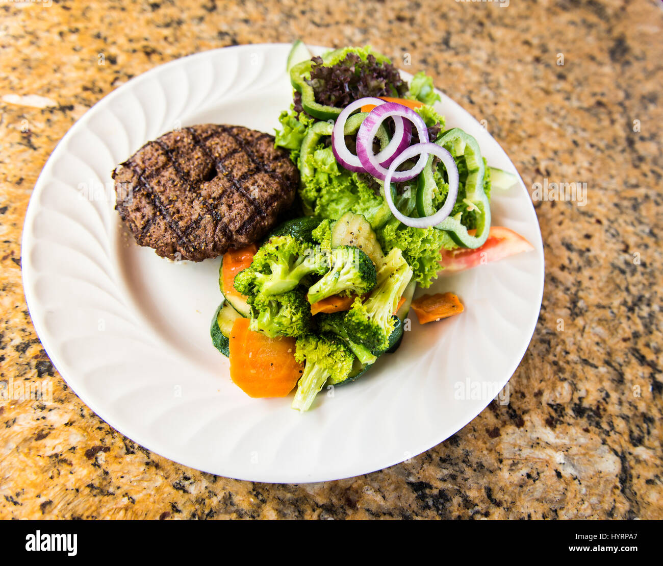 Meat Patty with salad and vegetables Stock Photo