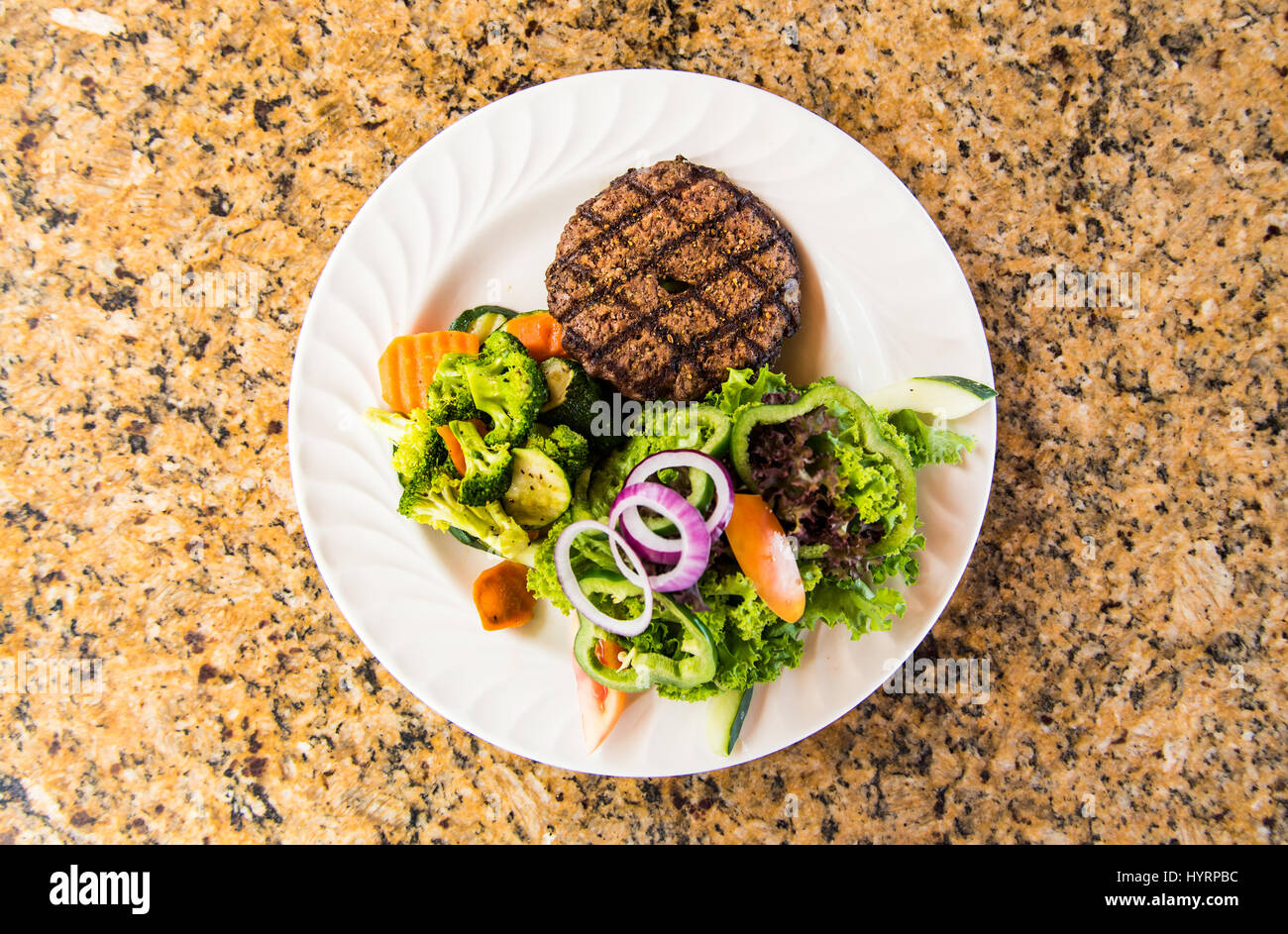 Meat Patty with salad and vegetables Stock Photo