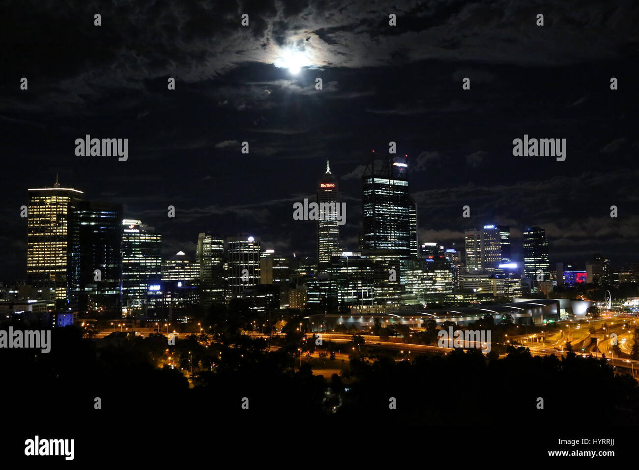 The full moon rises over the buildings in Perth, Australia. Perh is the state capital of Western