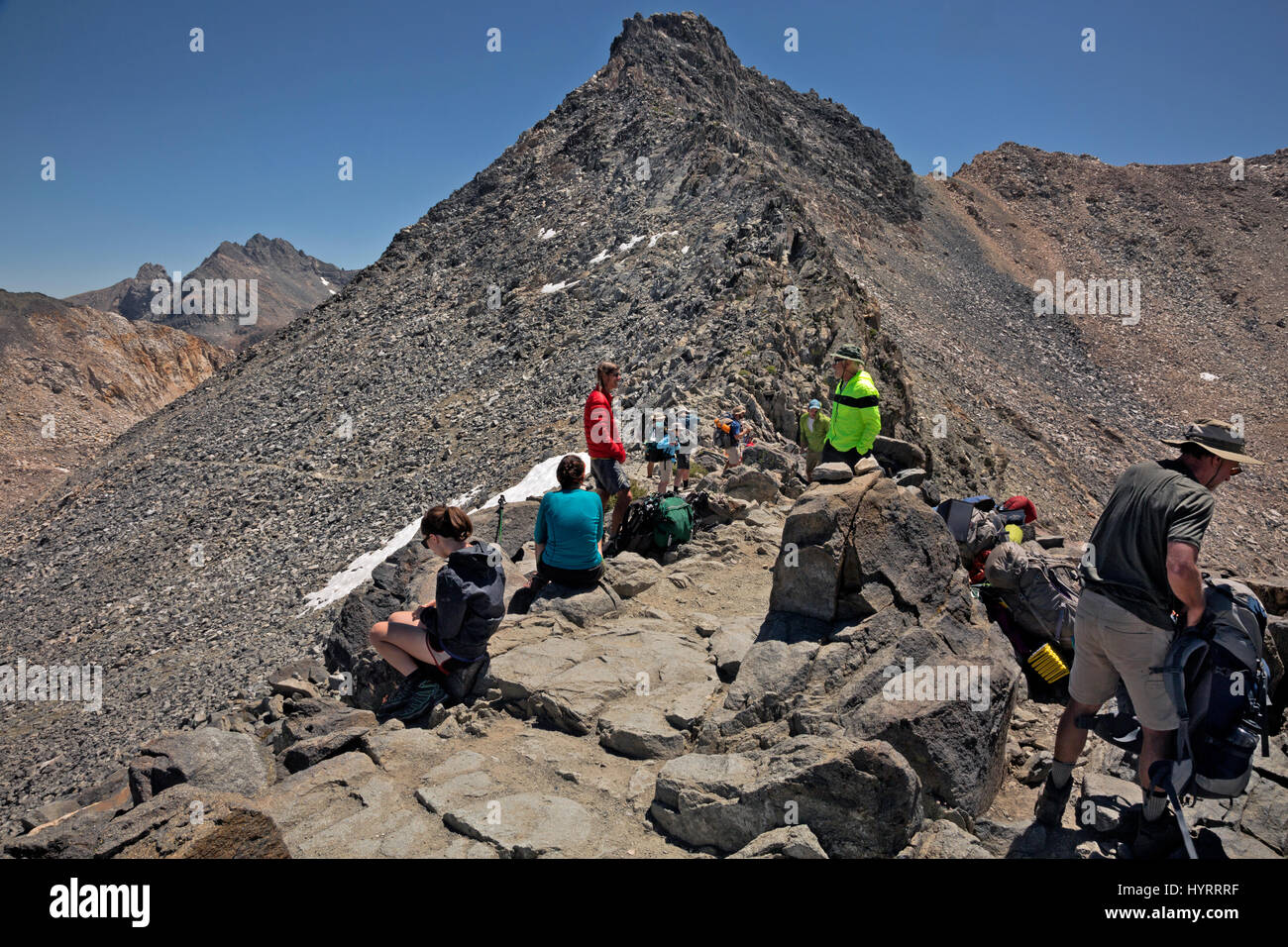 CA03198-00...CALIFORNIA - Hikers at the summit of Glen Pass on the combined JMT/PCT in Kings Canyon National Park. Stock Photo