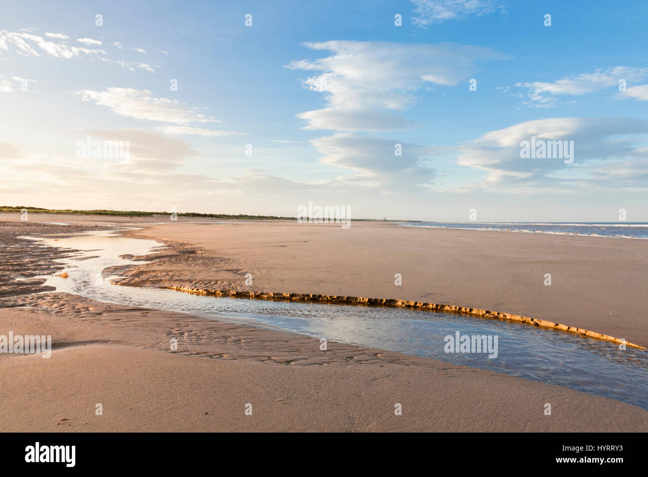 Tide ebbing on an empty beach at Gibraltar Point on the Lincolnshire coast, England, UK Stock Photo