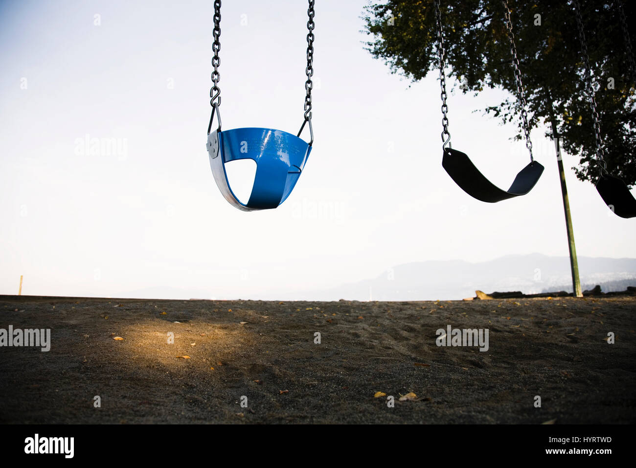 Swings at the beach Stock Photo Alamy